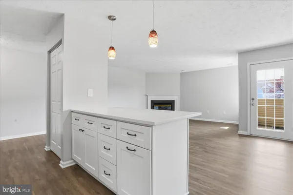 a view of kitchen with wooden floor