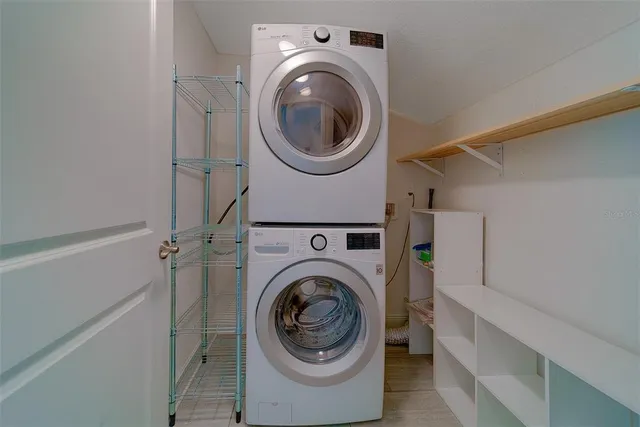 a bedroom with a bed and a large mirror