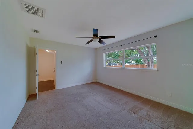 a bathroom with a sink toilet vanity and bathtub