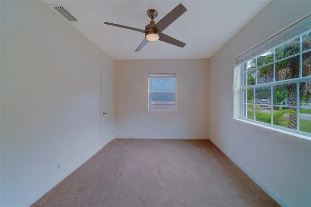a backyard of a house with plants and trees