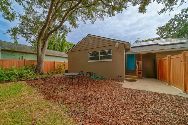 a backyard of a house with lots of green space