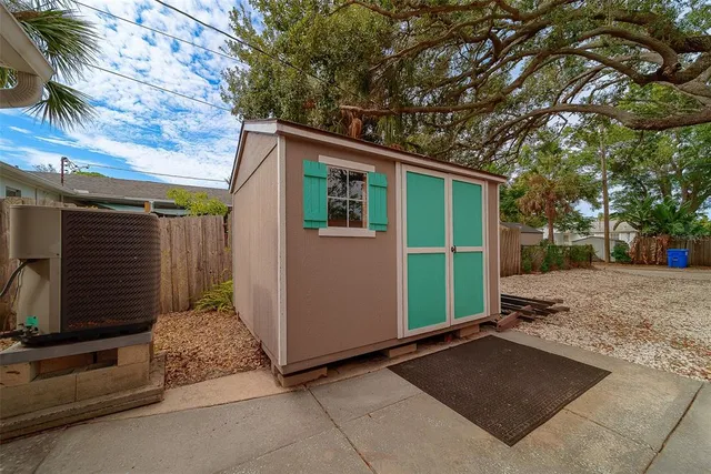 a front view of a house with yard patio and green space
