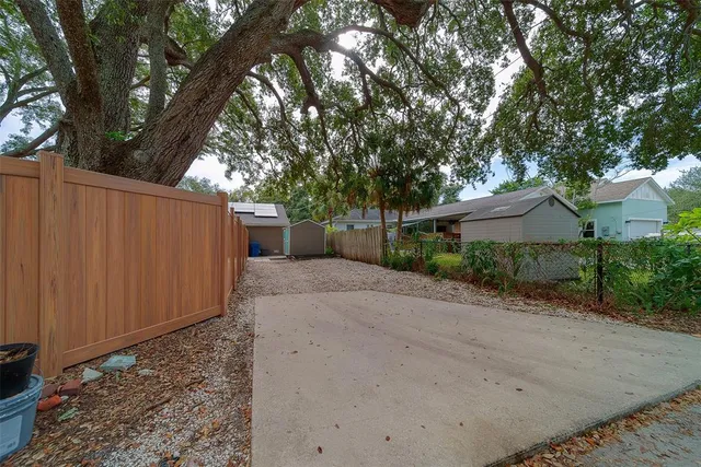 an aerial view of a house with a yard and garden