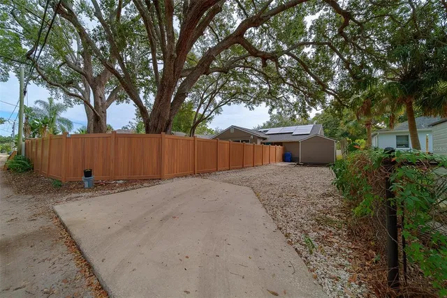 an aerial view of a house with a yard and garden