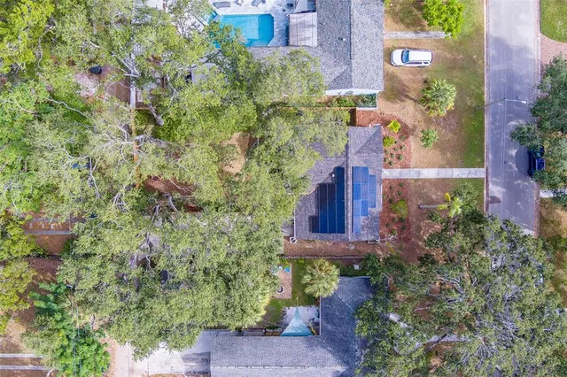 an aerial view of residential house with outdoor space and swimming pool