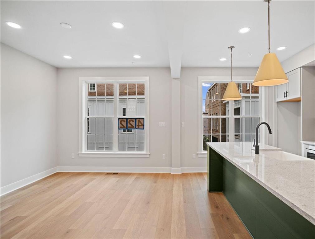 212 Oliver Way Cranberry Township, PA 16066 - Photo 11 of 49 a kitchen with kitchen island a sink stainless steel appliances and cabinets