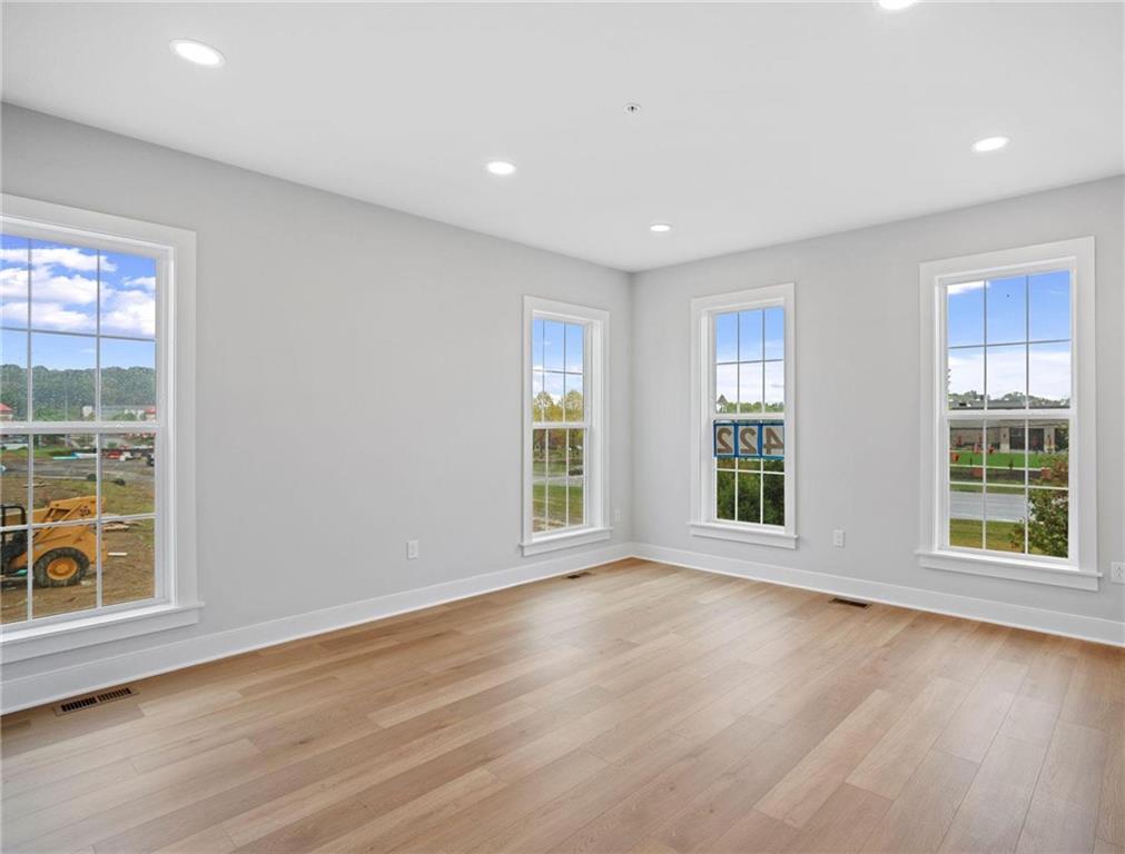 212 Oliver Way Cranberry Township, PA 16066 - Photo 12 of 49 an empty room with wooden floor and windows