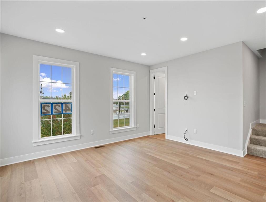 212 Oliver Way Cranberry Township, PA 16066 - Photo 13 of 49 an empty room with wooden floor and windows