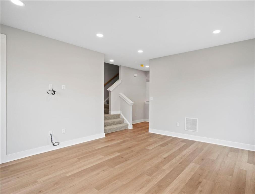 212 Oliver Way Cranberry Township, PA 16066 - Photo 14 of 49 a view of empty room with wooden floor