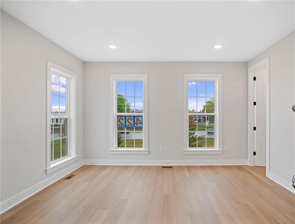 212 Oliver Way Cranberry Township, PA 16066 - Photo 16 of 49 an empty room with wooden floor and windows