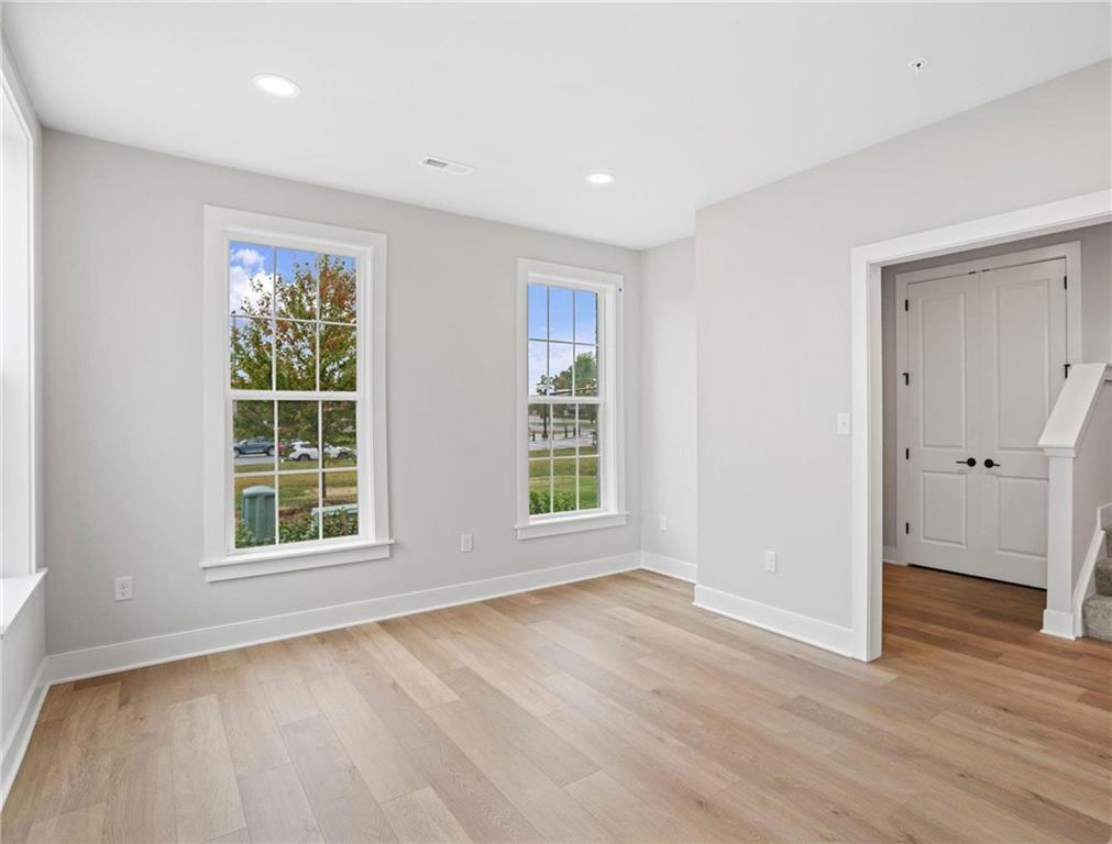 212 Oliver Way Cranberry Township, PA 16066 - Photo 18 of 49 a view of an empty room with wooden floor and windows