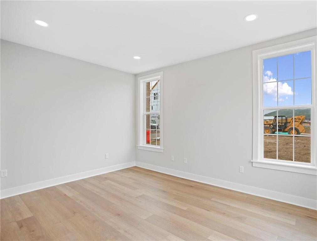 212 Oliver Way Cranberry Township, PA 16066 - Photo 20 of 49 an empty room with wooden floor and windows