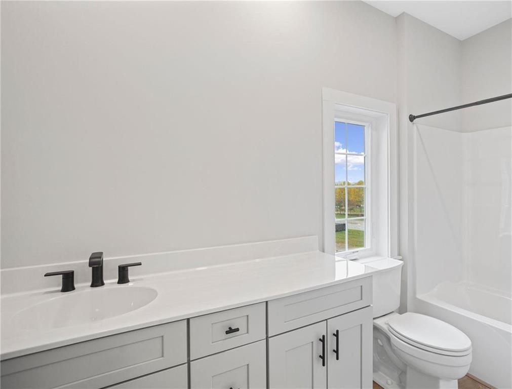 212 Oliver Way Cranberry Township, PA 16066 - Photo 29 of 49 a bathroom with a sink a toilet and a window