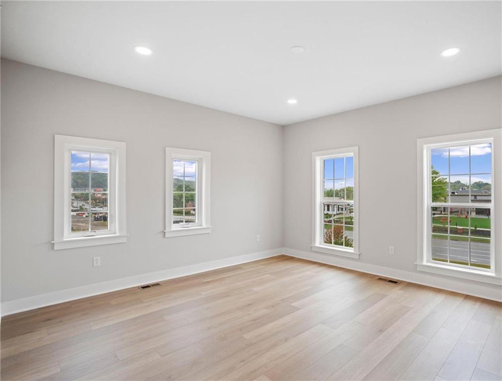 212 Oliver Way Cranberry Township, PA 16066 - Photo 31 of 49 a view of an empty room with wooden floor and a window