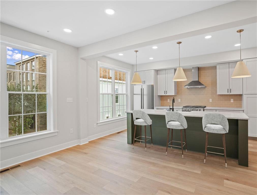 212 Oliver Way Cranberry Township, PA 16066 - Photo 4 of 49 a large kitchen with a table and chairs