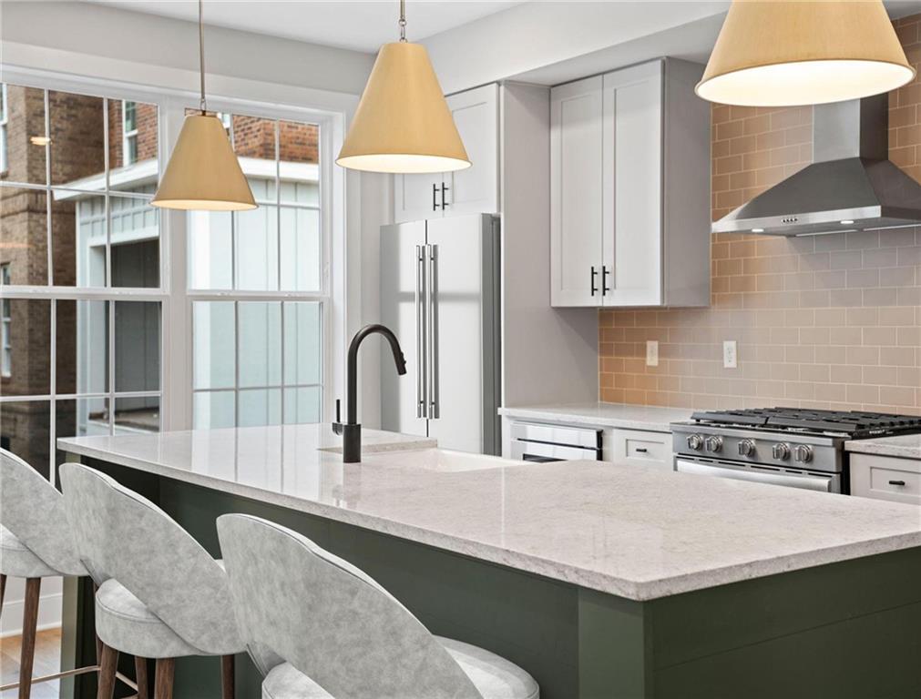 212 Oliver Way Cranberry Township, PA 16066 - Photo 5 of 49 a kitchen with a table chairs and a sink