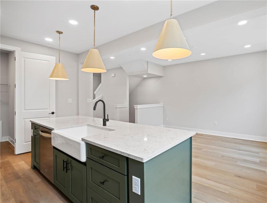 212 Oliver Way Cranberry Township, PA 16066 - Photo 6 of 49 a kitchen with a sink cabinets and wooden floor