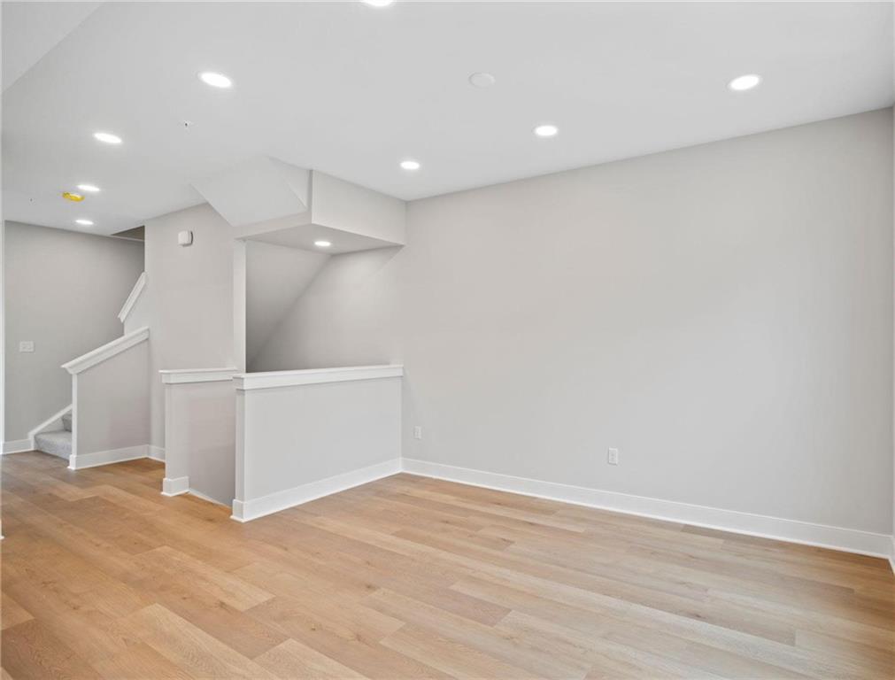 212 Oliver Way Cranberry Township, PA 16066 - Photo 9 of 49 an empty room with wooden floor and white walls
