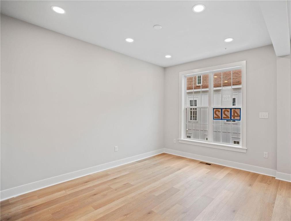 212 Oliver Way Cranberry Township, PA 16066 - Photo 10 of 49 wooden floor in an empty room with a window