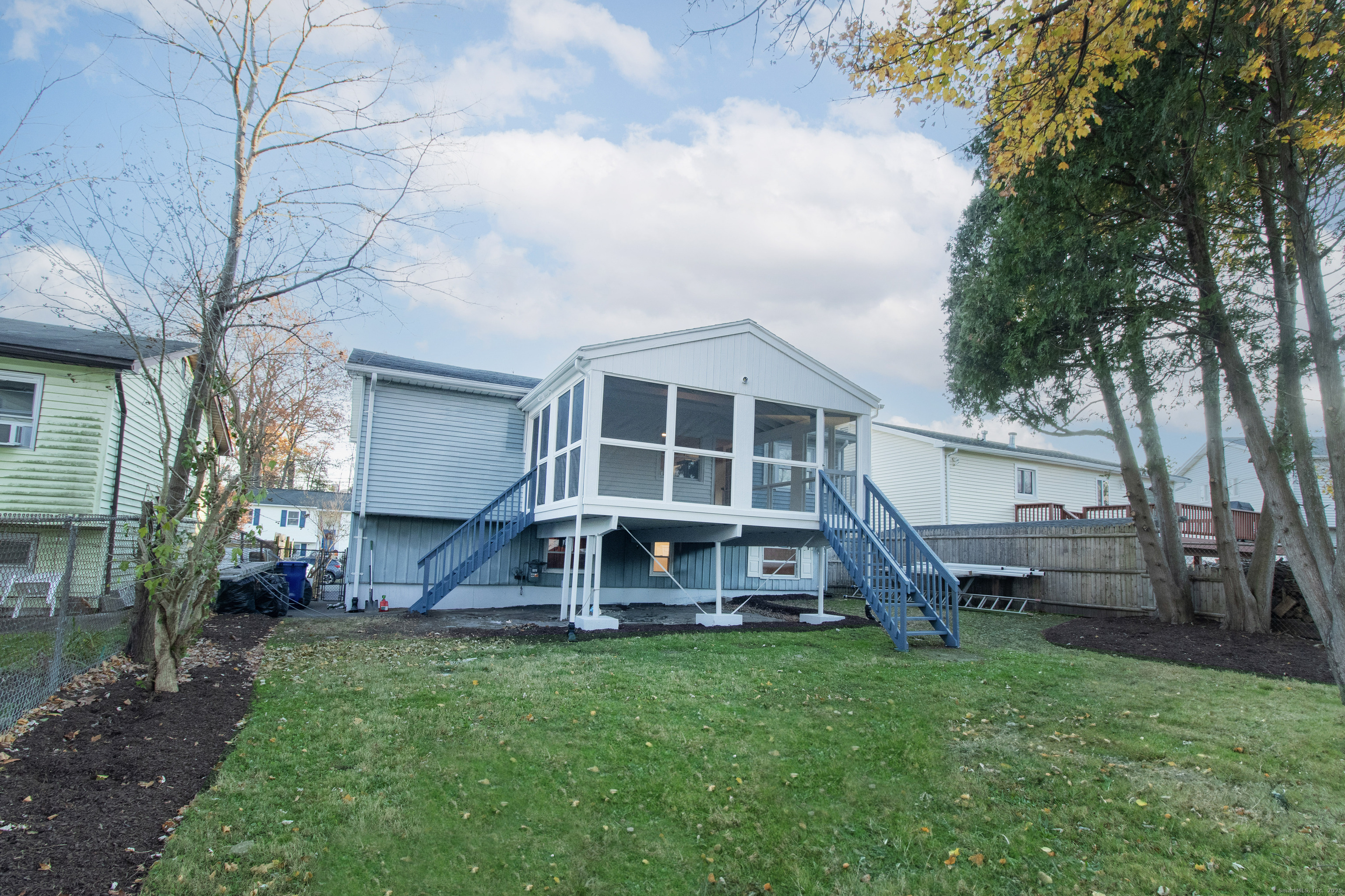 14 Windward Road Norwalk, CT 06854 - Photo 9 of 35 Freshly landscaped outdoor space, stairs leading to seasonal room