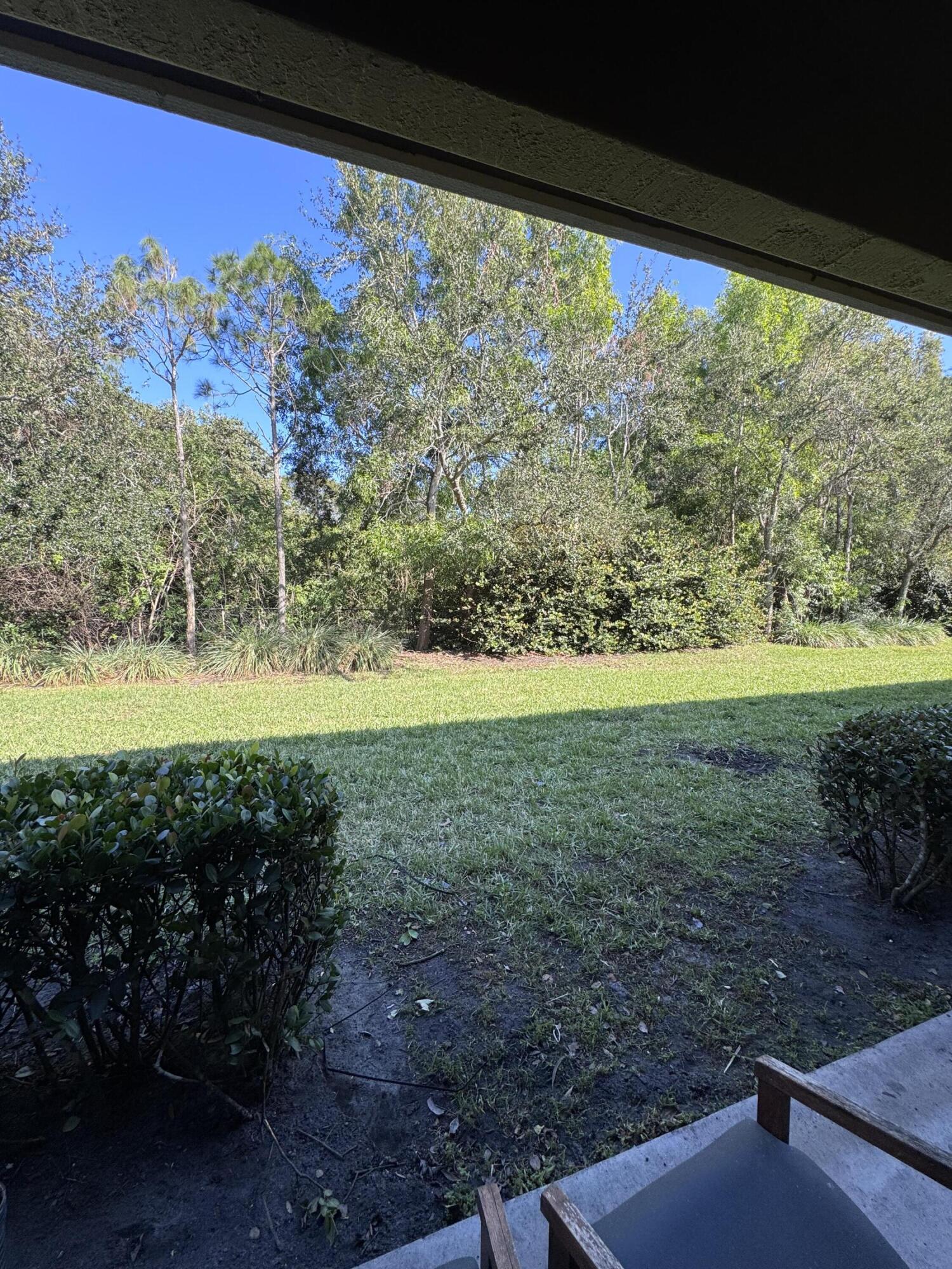 2755 Southeast Birmingham Drive, Unit 3 Stuart, FL 34994 - Photo 12 of 23 a view of a yard with a large tree