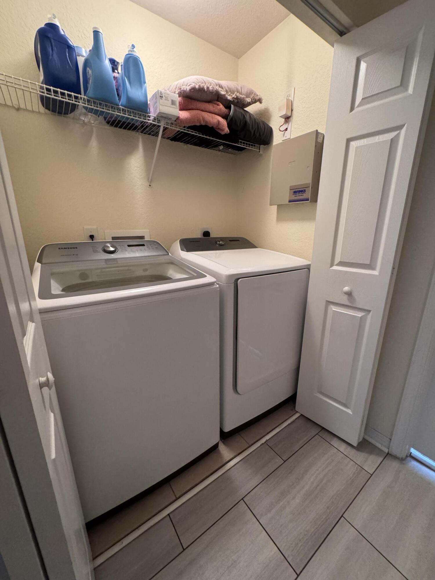 2755 Southeast Birmingham Drive, Unit 3 Stuart, FL 34994 - Photo 17 of 23 a utility room with dryer and washer