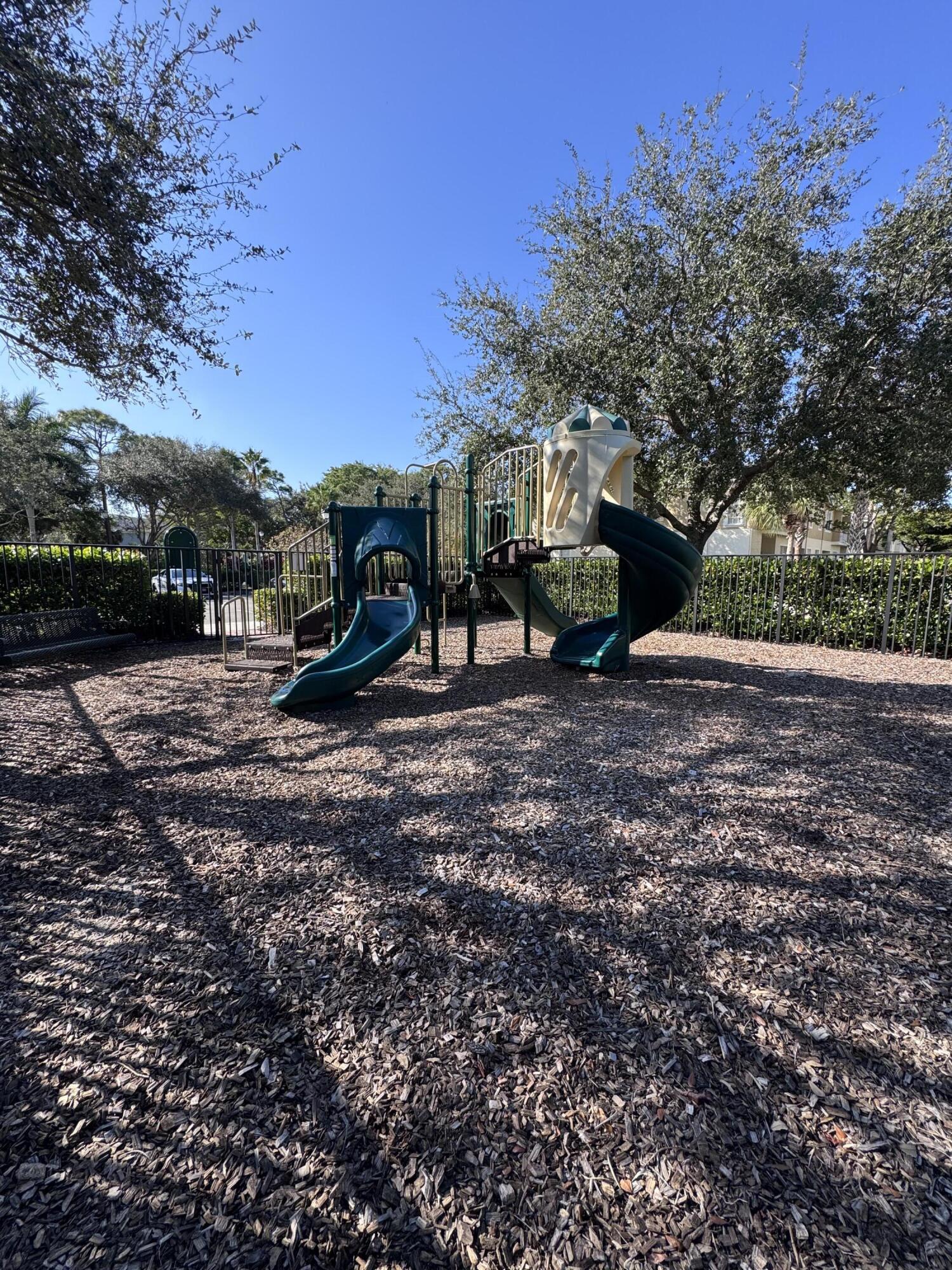 2755 Southeast Birmingham Drive, Unit 3 Stuart, FL 34994 - Photo 22 of 23 a view of a park with large trees