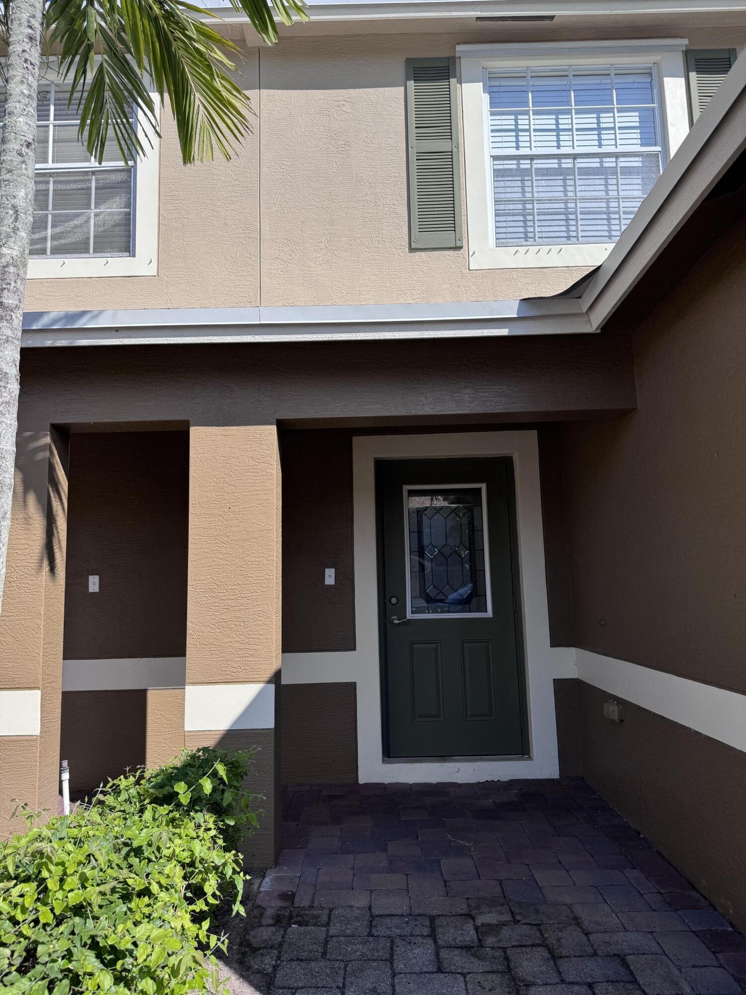 2755 Southeast Birmingham Drive, Unit 3 Stuart, FL 34994 - Photo 3 of 23 a house with a door