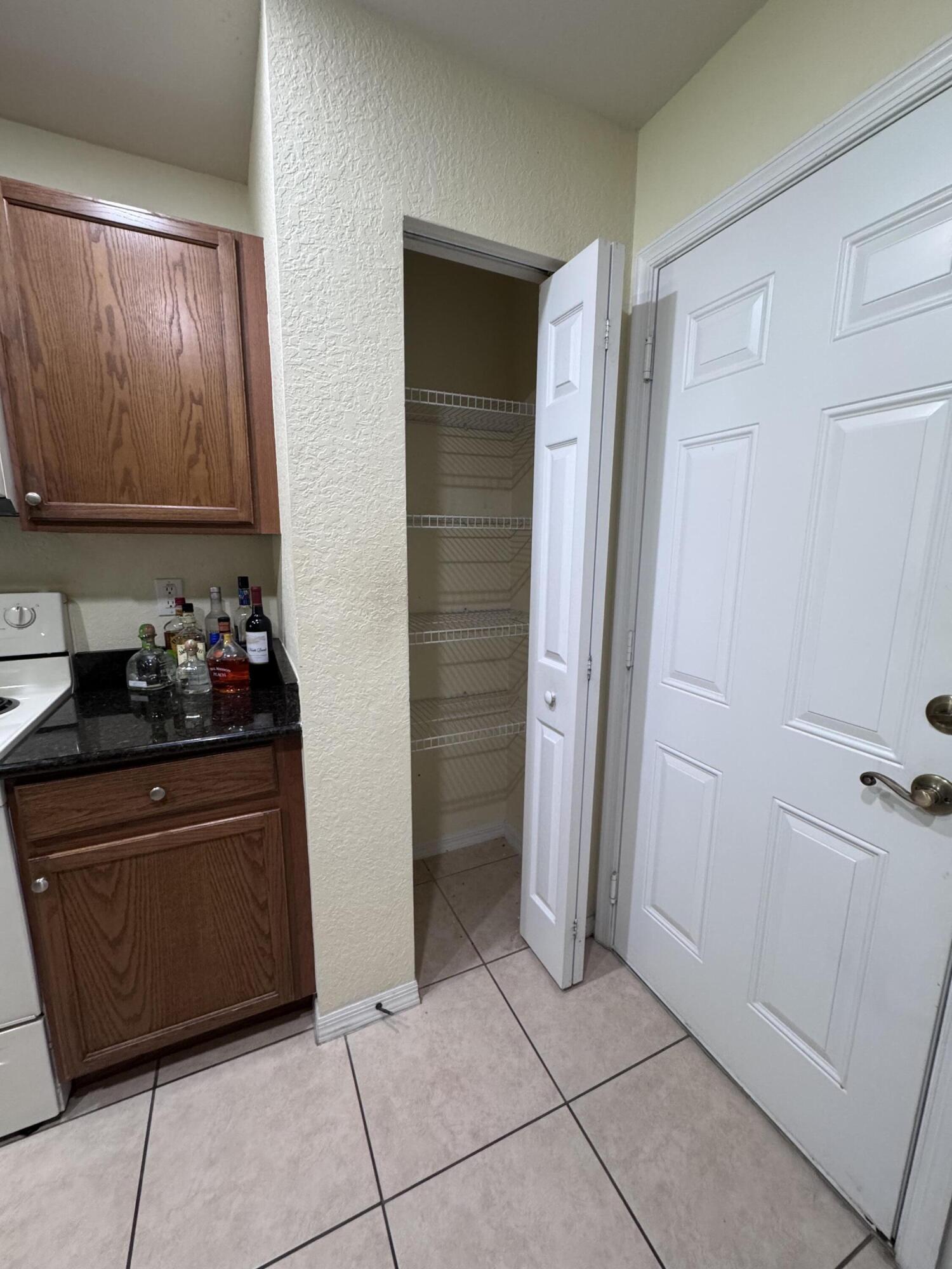 2755 Southeast Birmingham Drive, Unit 3 Stuart, FL 34994 - Photo 5 of 23 a room with cabinets and a window