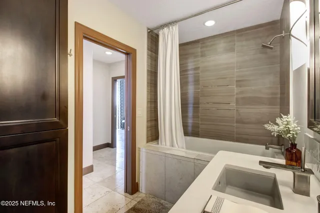 a bedroom with a large bed and a balcony view