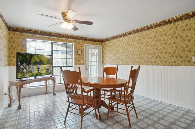 a view of a dining room with furniture window and outside view