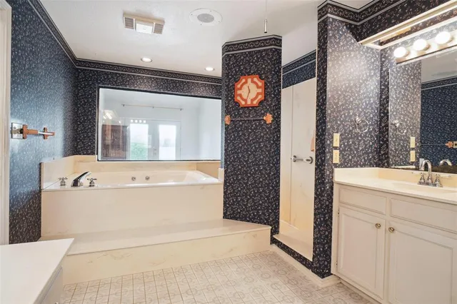 a view of bathroom with a bathtub mirror and sink