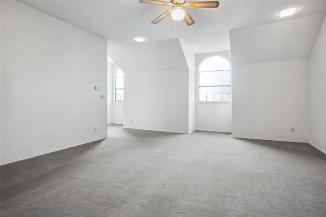 an empty room with a empty space and a window