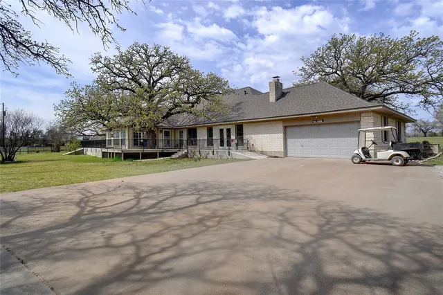 a view of a house with a big yard