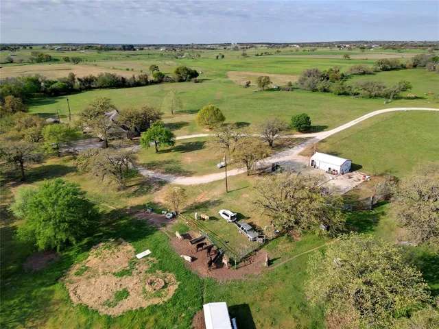 an aerial view of a house with a lake view