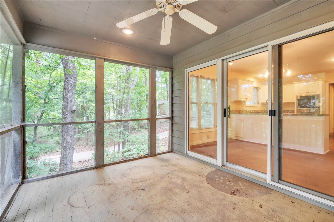 149 Inlet Pointe Drive Anderson, SC 29625 - Photo 27 of 43 A spacious screened porch offers tranquil views of a wooded landscape.