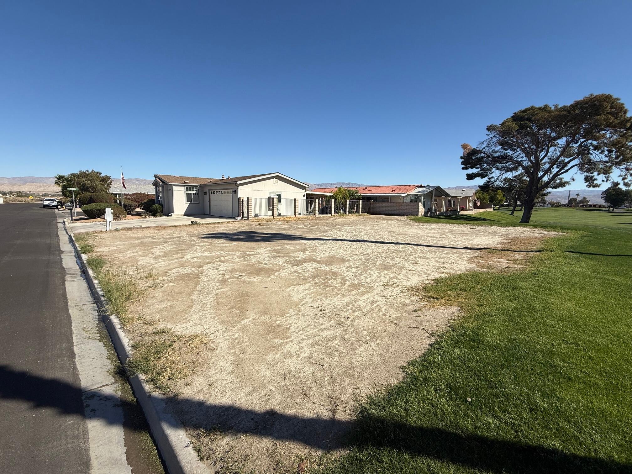33660 Les Road Thousand Palms, CA 92276 - Photo 2 of 4 a view of a yard with an outdoor space