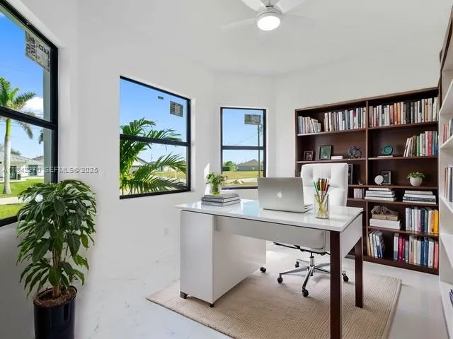 a room with furniture and a potted plant