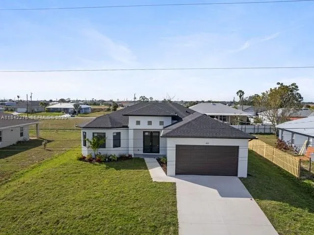 a aerial view of a house with swimming pool
