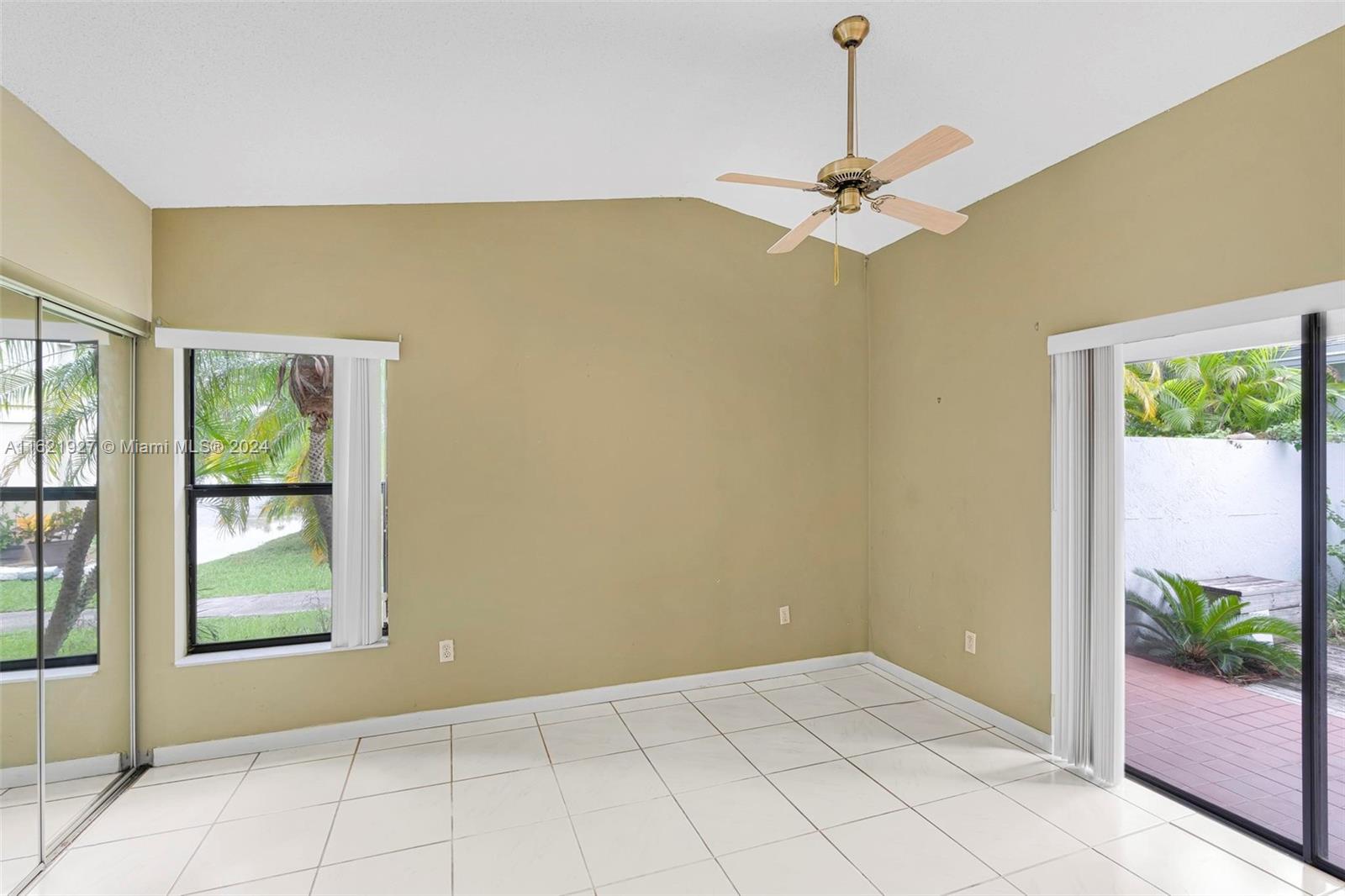 6604 Southwest 152nd Place, Unit 2604 Miami, FL 33193 - Photo 14 of 27 a view of an empty room with windows