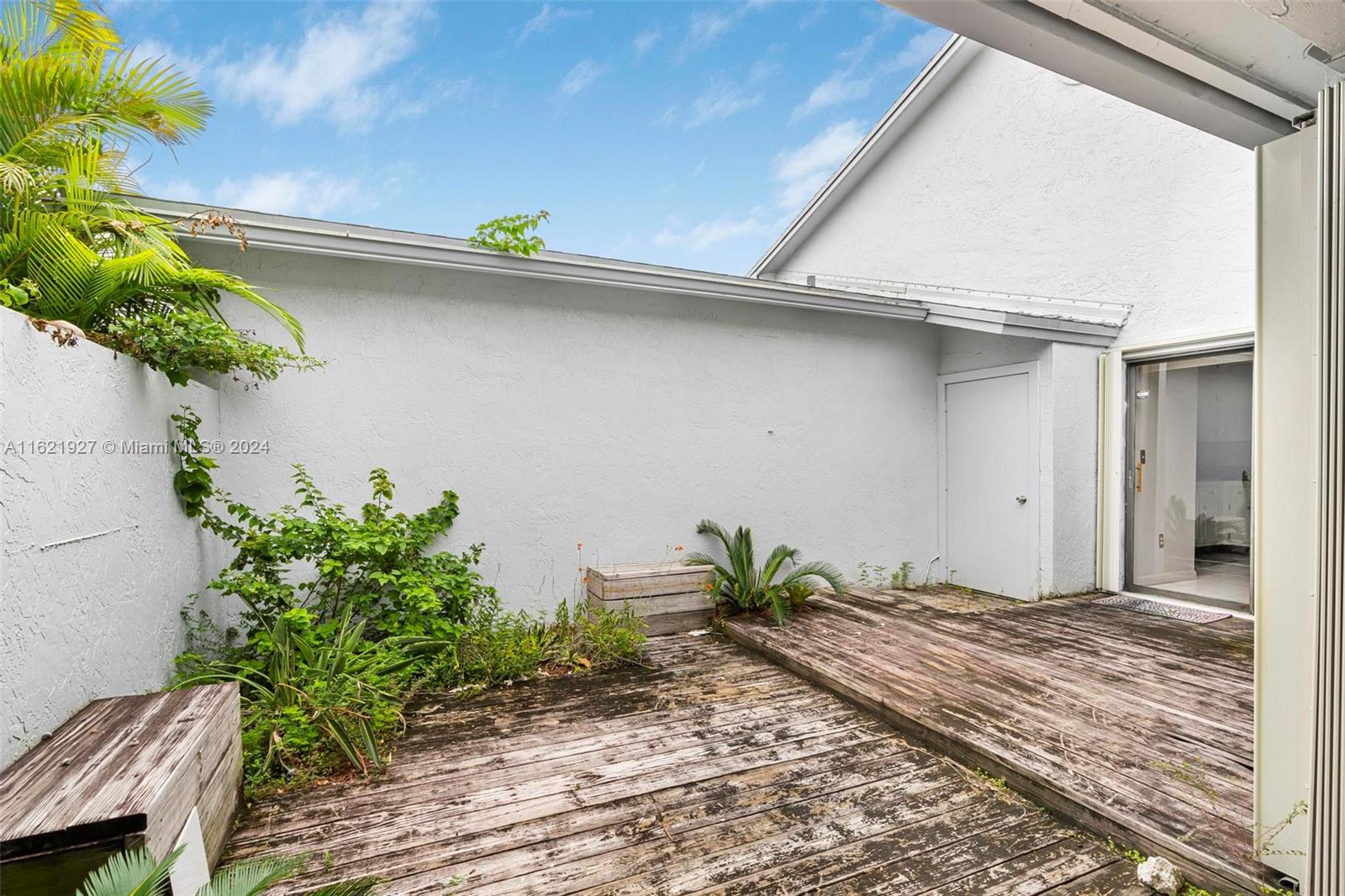 6604 Southwest 152nd Place, Unit 2604 Miami, FL 33193 - Photo 19 of 27 a view of a house with a wooden fence