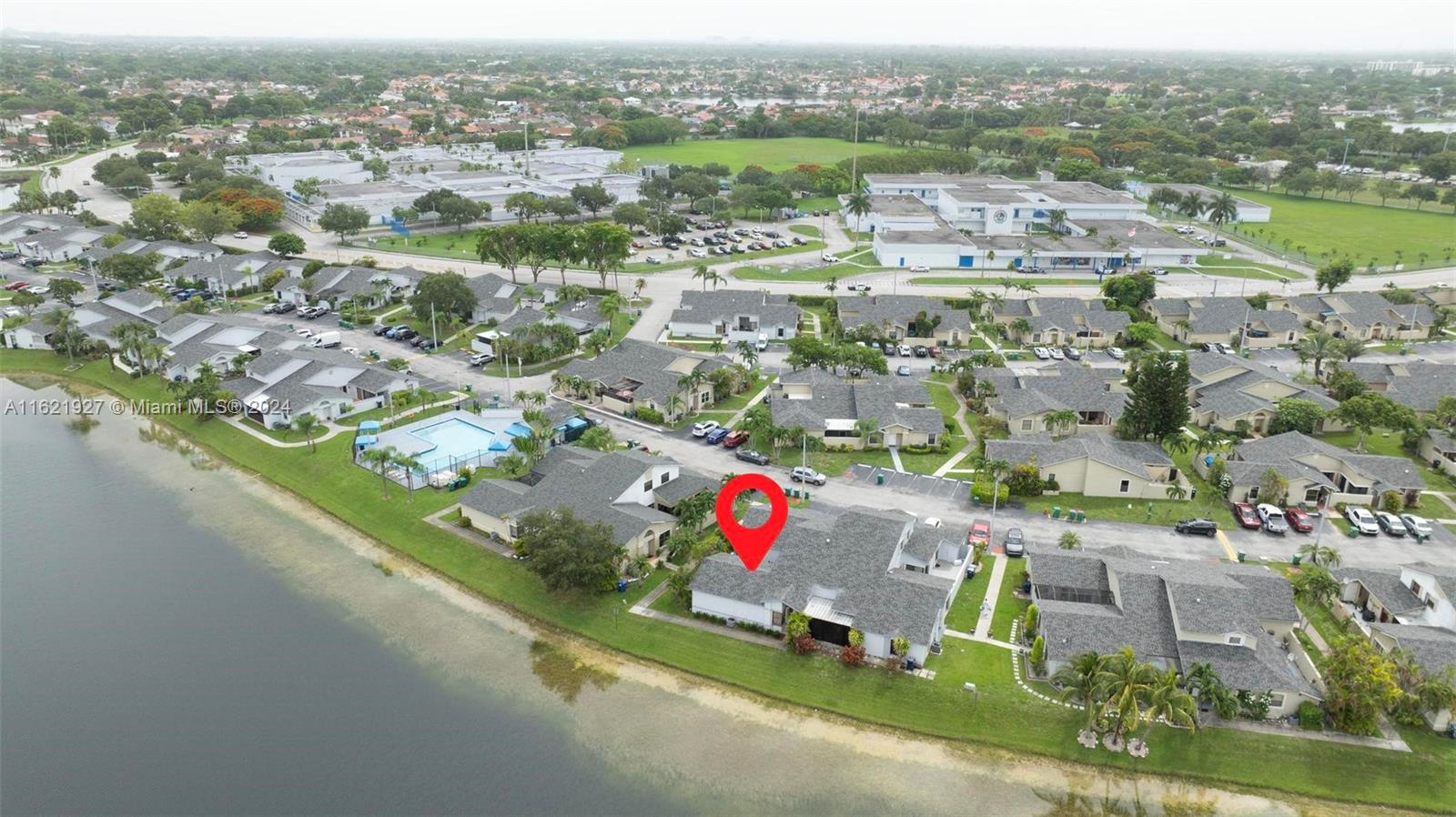 6604 Southwest 152nd Place, Unit 2604 Miami, FL 33193 - Photo 24 of 27 an aerial view of residential houses with outdoor space and river