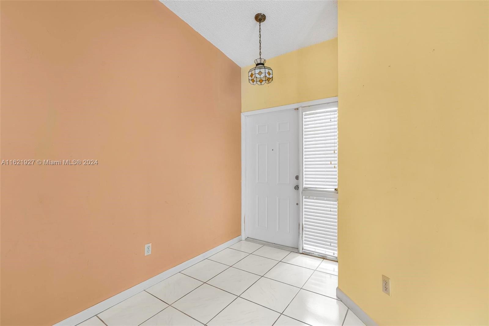 6604 Southwest 152nd Place, Unit 2604 Miami, FL 33193 - Photo 5 of 27 a view of a hallway with a white wall