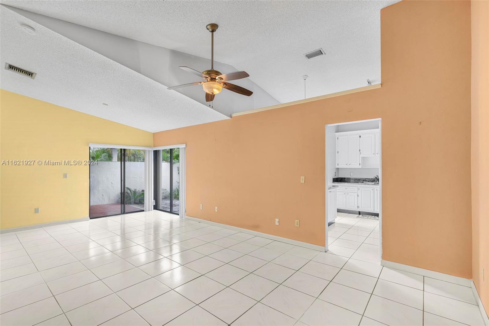 6604 Southwest 152nd Place, Unit 2604 Miami, FL 33193 - Photo 6 of 27 a view of an empty room with a window