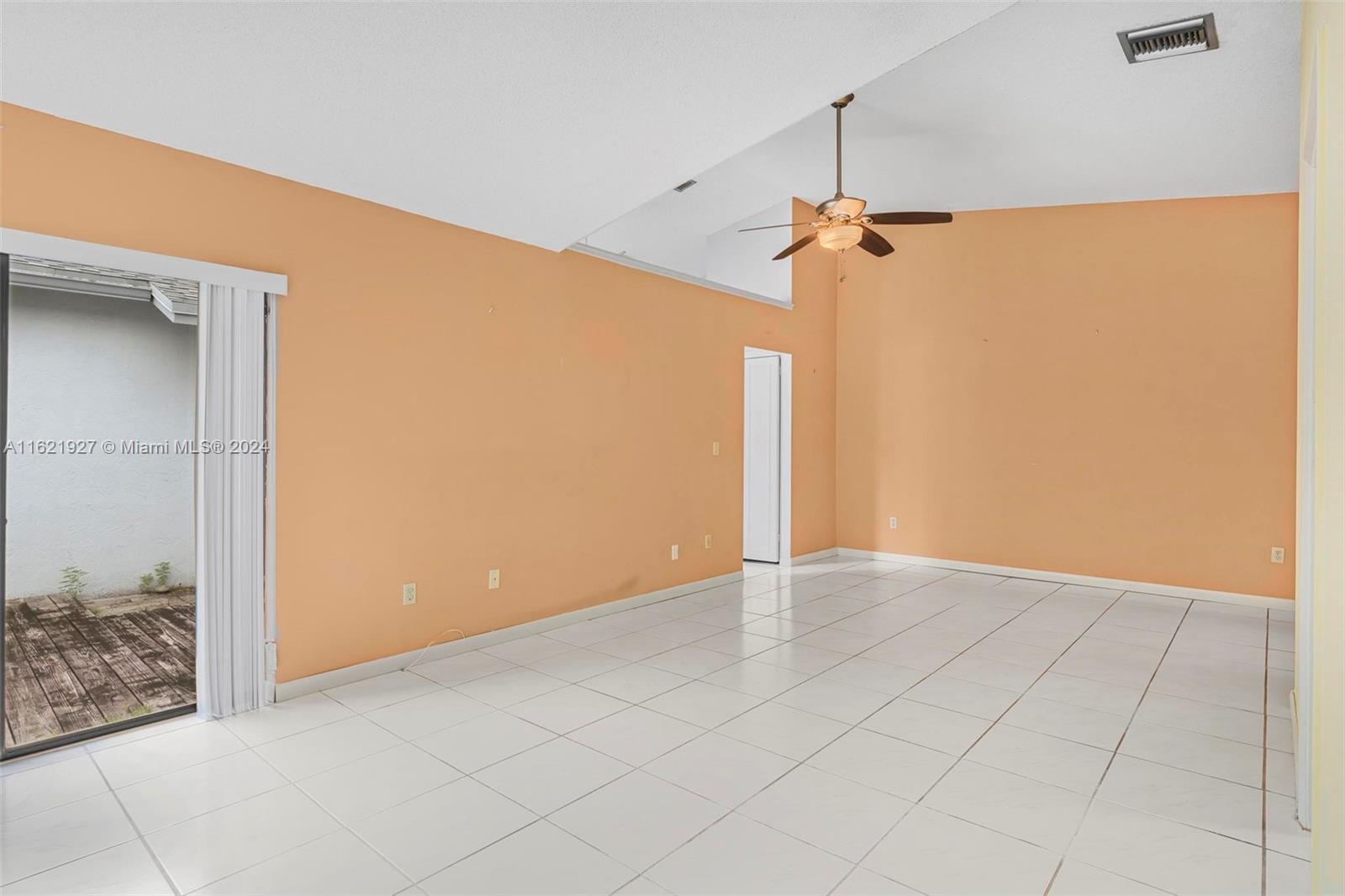 6604 Southwest 152nd Place, Unit 2604 Miami, FL 33193 - Photo 9 of 27 an empty room with windows