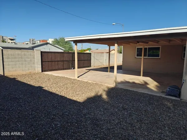 a view of a backyard of the house