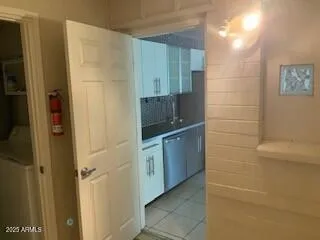 a bathroom with a double vanity sink a toilet and a mirror