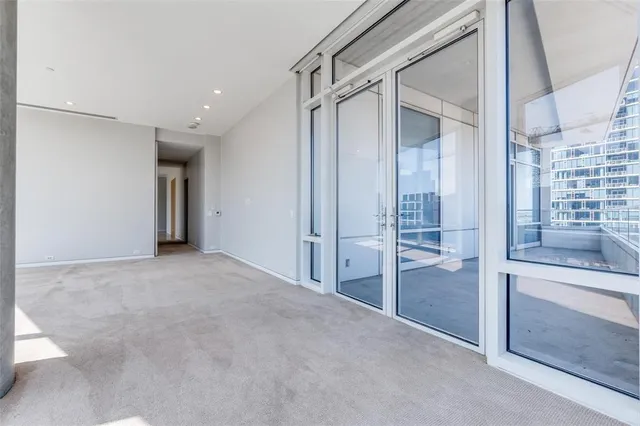 a view of an empty room and a window