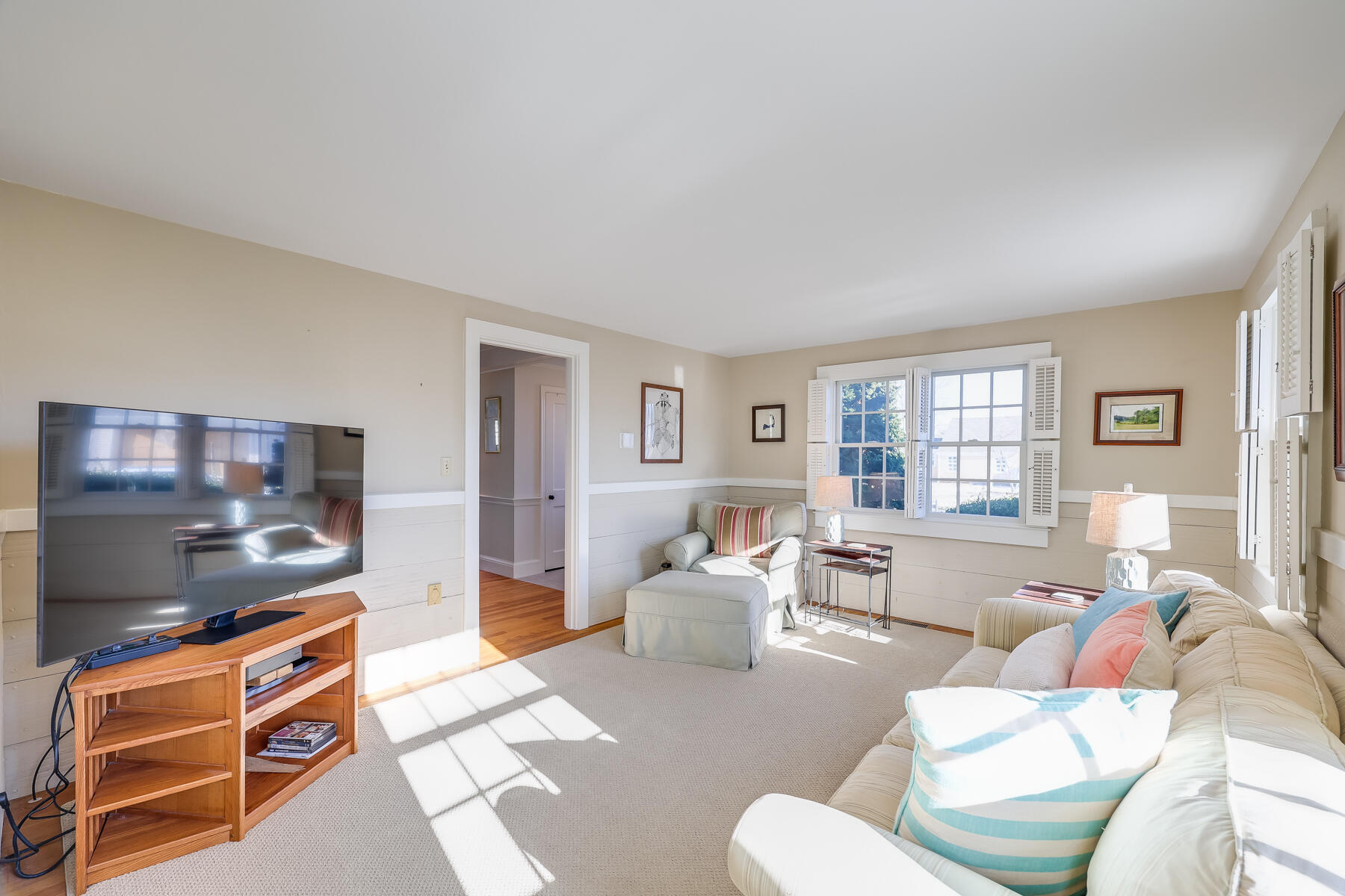 87 First Avenue Hyannis Port, MA 02601 - Photo 13 of 29 a living room with furniture a flat screen tv and a window