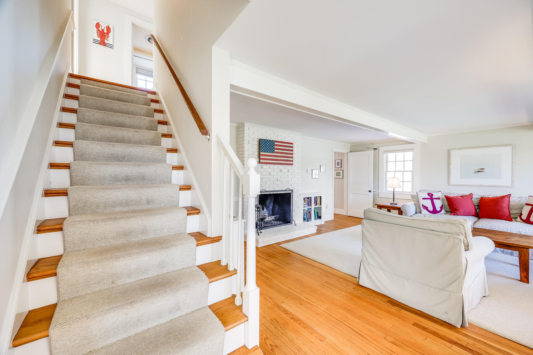 87 First Avenue Hyannis Port, MA 02601 - Photo 15 of 29 a living room with furniture and a fireplace
